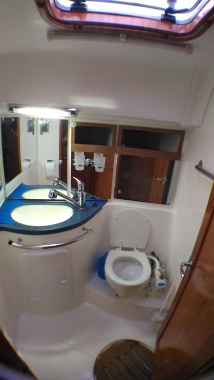 One of the two bathrooms, with a basin and toilet