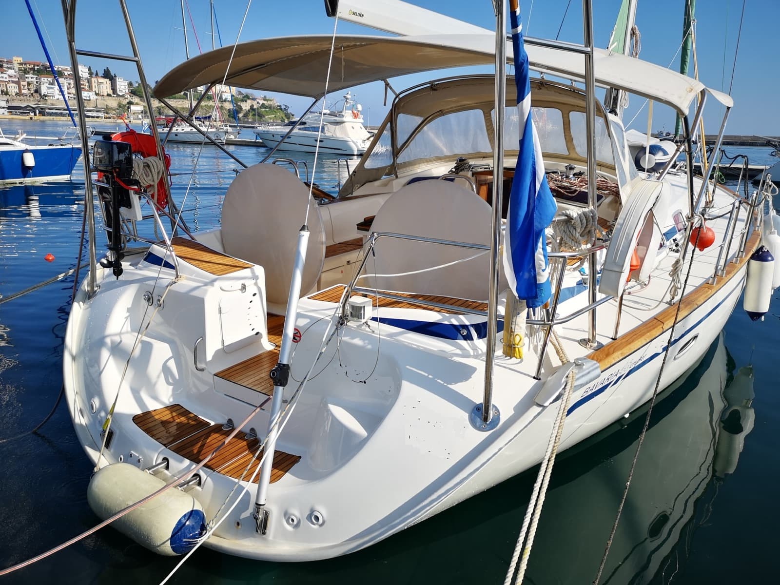 The stern and cockpit of the yacht in a harbour