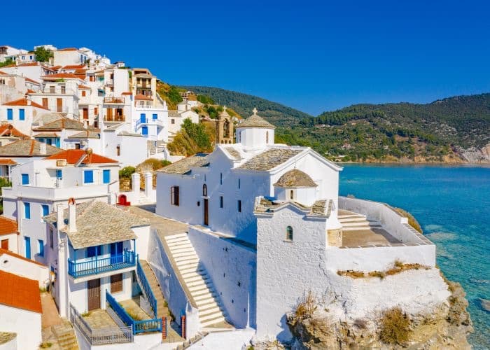 White houses and a church above the sea on one of the Sporades islands