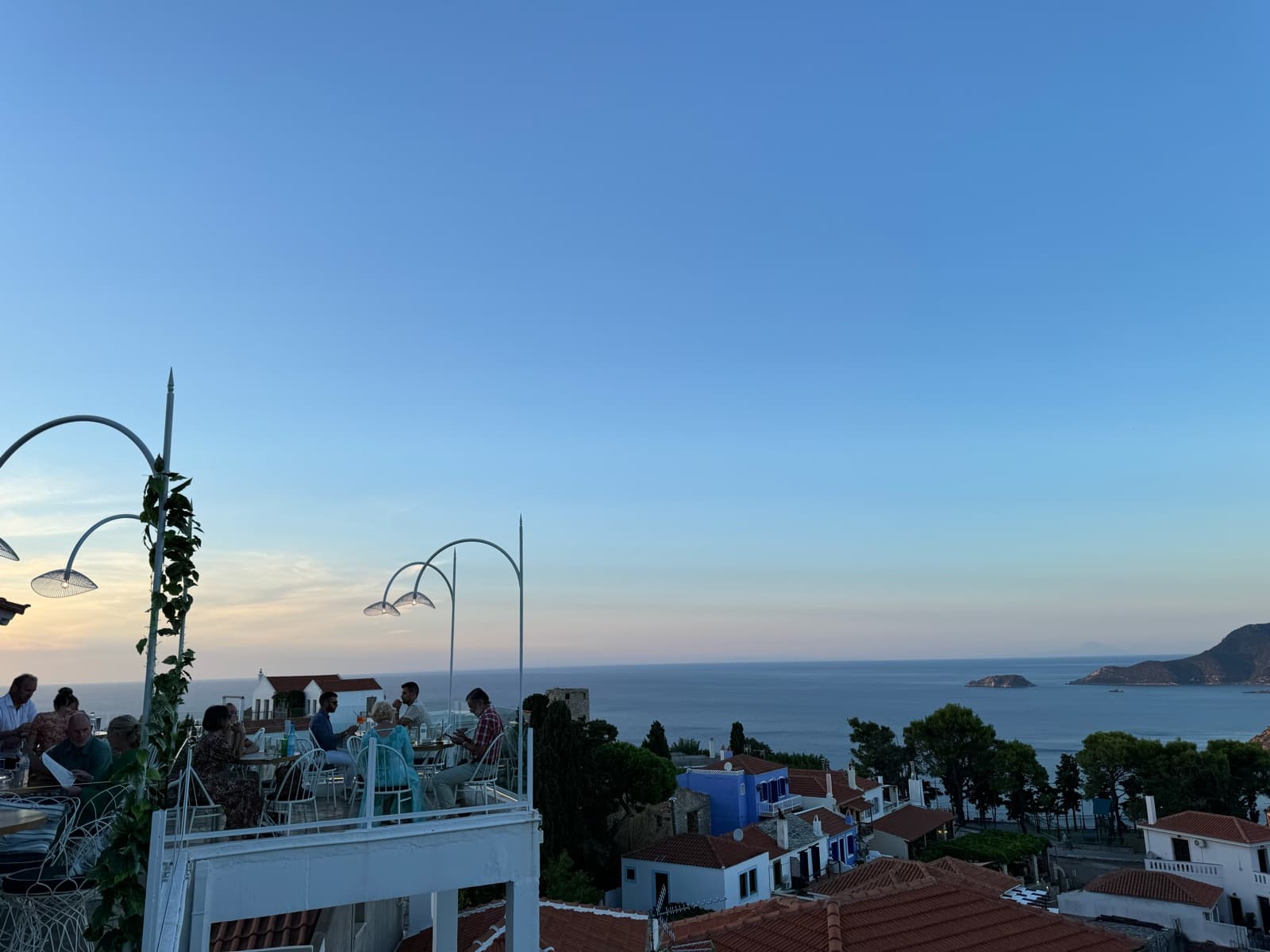 Dinner on a terrace above the sea in an island village