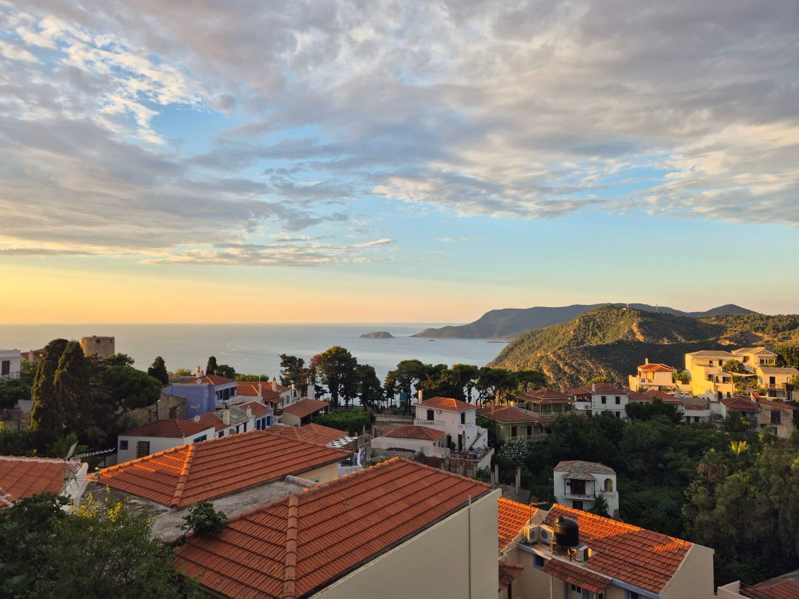Red roofs and the sea at sunset from an island village