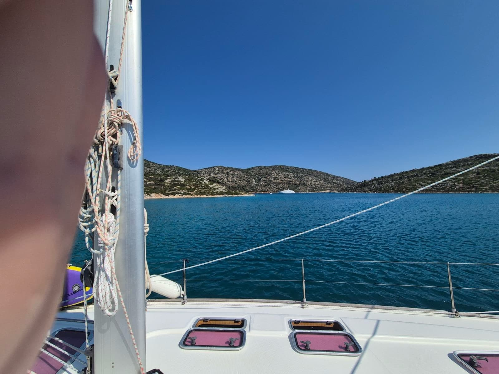 Open sea and distant hills, seen from the deck
