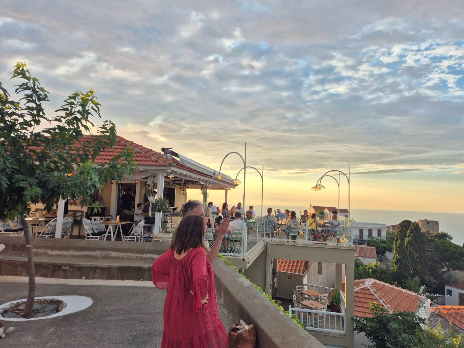 A village square above the sea in the evening light