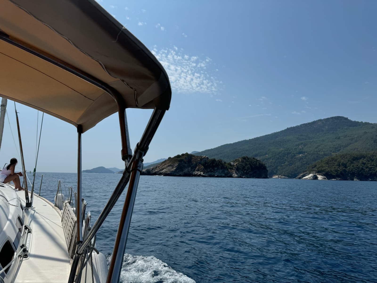 The yacht under sail with an island ahead